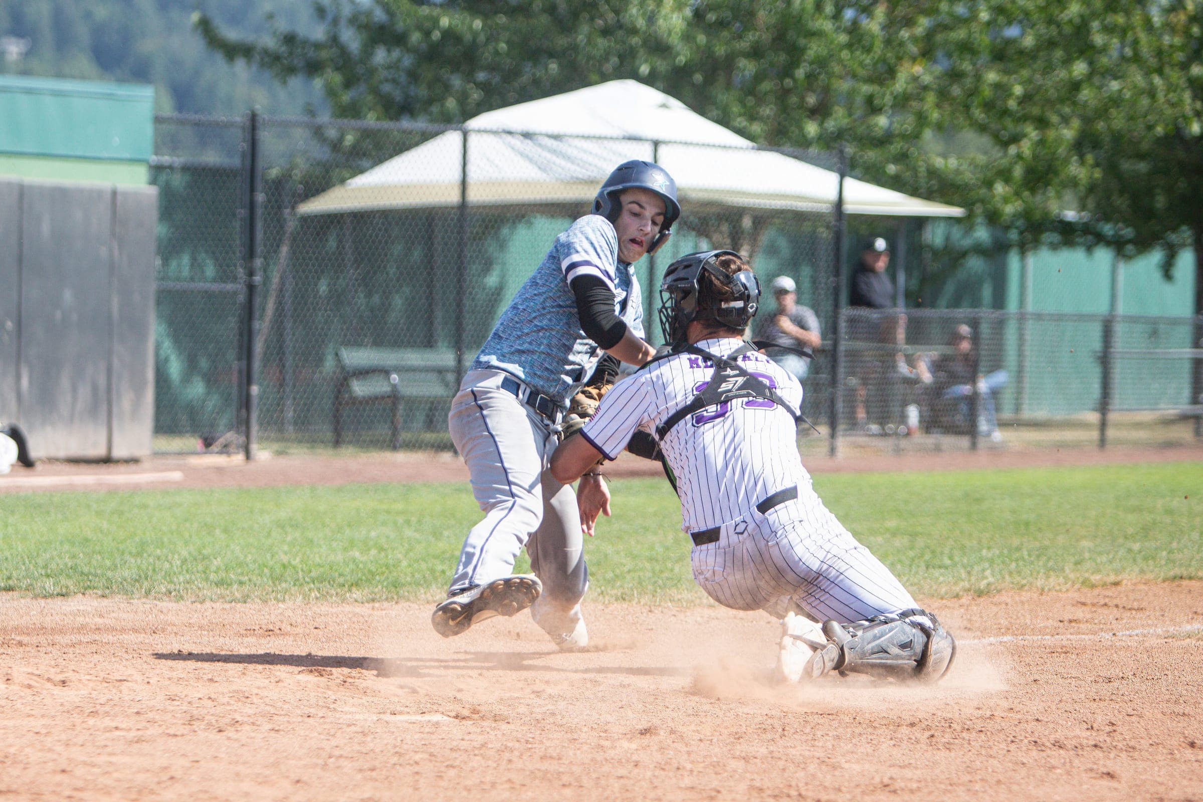 Runner colliding with the catcher at home plate