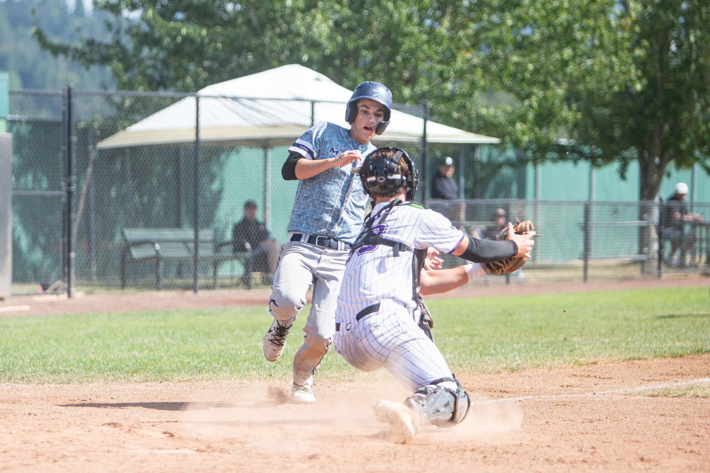 Runner arriving at home as the catcher turns for the tag