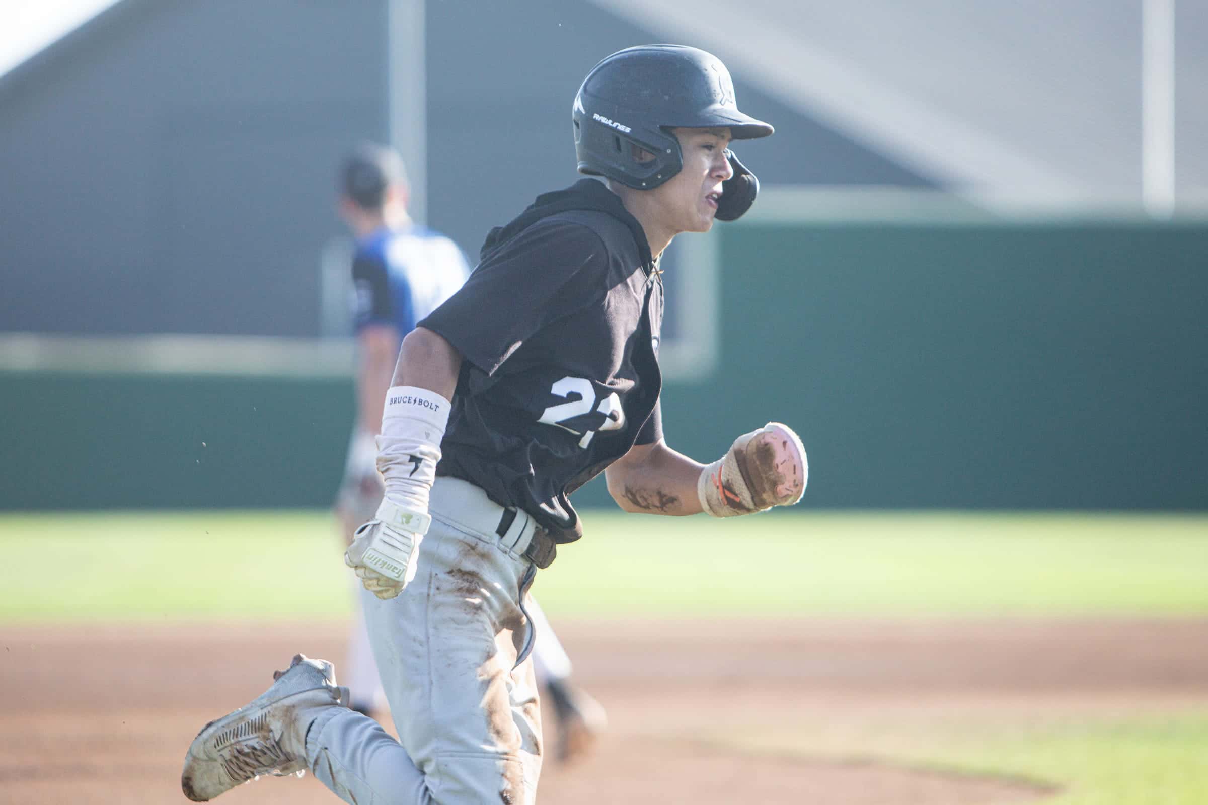 Runner in black charging toward the camera, shot low