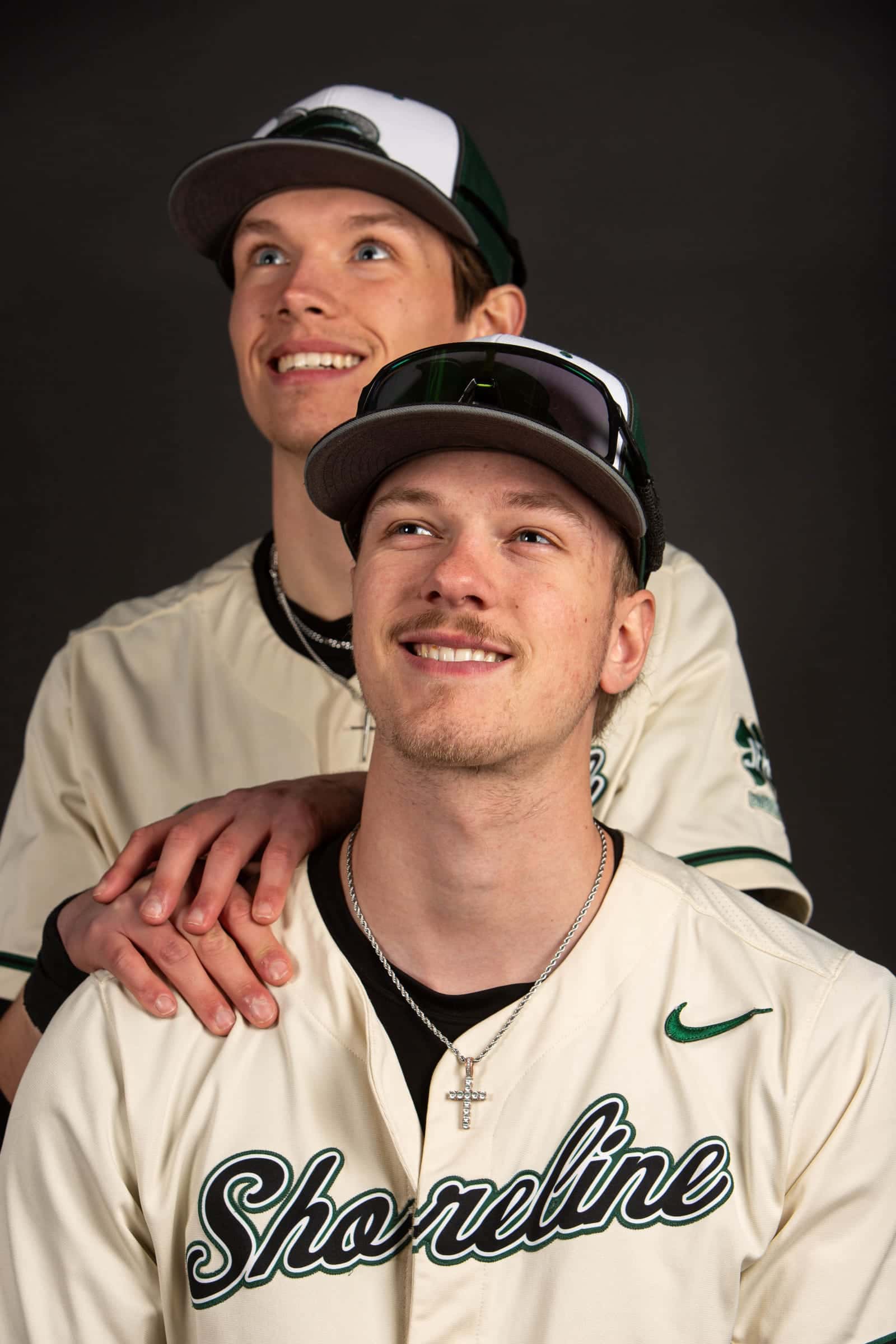 Two Shoreline teammates posing, one with a hand on the other's shoulder